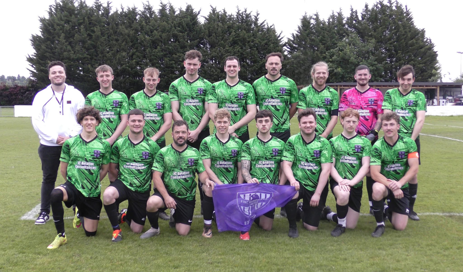 Finchampstead United full squad team photo in green kit with the club flag before kick-off