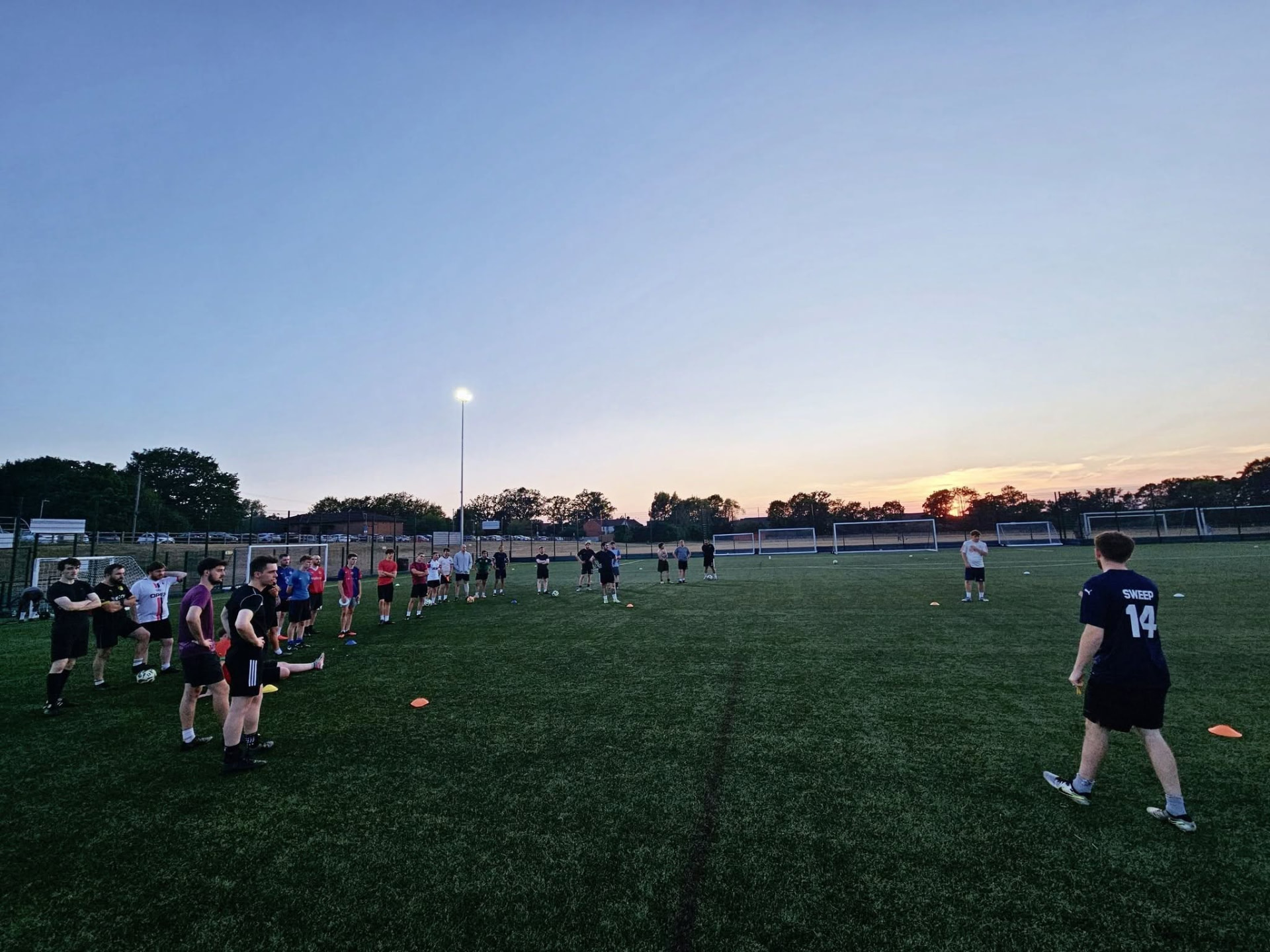 Finchampstead United squad training on the 3G pitch at sunset